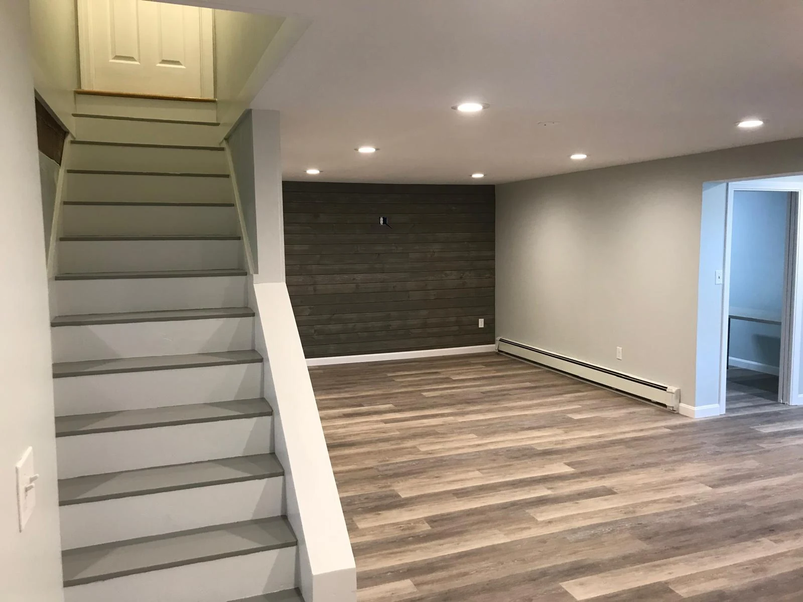 Finished basement living space photo 2 by Craftsman Home Improvement Inc.